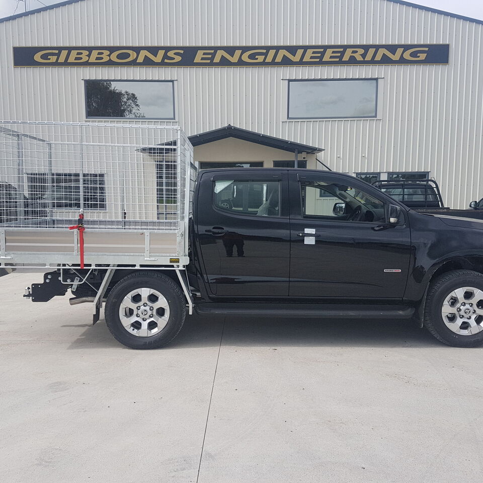Side profile of a custom ute tray with removable mesh cage sides built by Gibbons Engineering outside their workshop.
