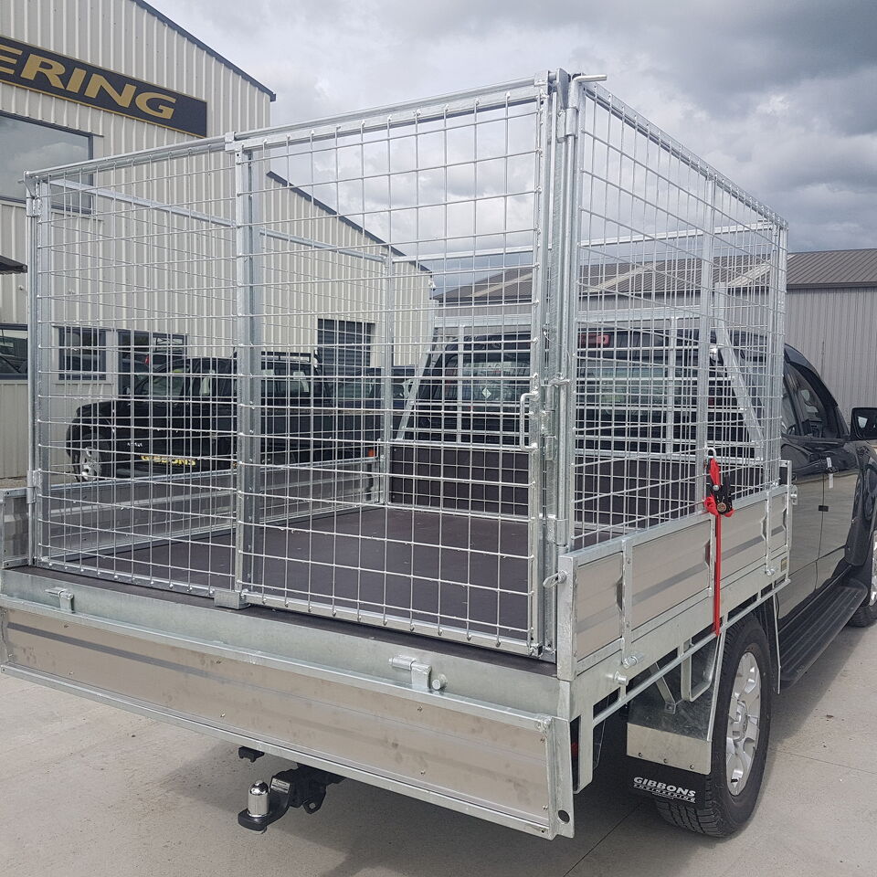 Custom galvanised mesh cage tray fitted to a utility vehicle for secure transport and trade use by Gibbons Engineering.
