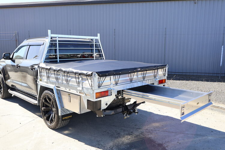 Custom ute tray with rear slide out drawer system and protective tonneau cover manufactured by Gibbons Engineering.