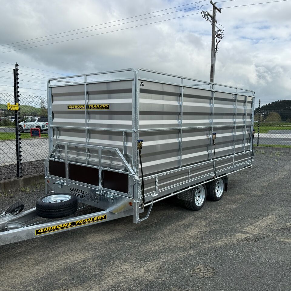 Tandem axle livestock trailer manufactured by Gibbons Engineering parked outdoors at the workshop.